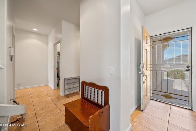 entryway with light tile patterned floors