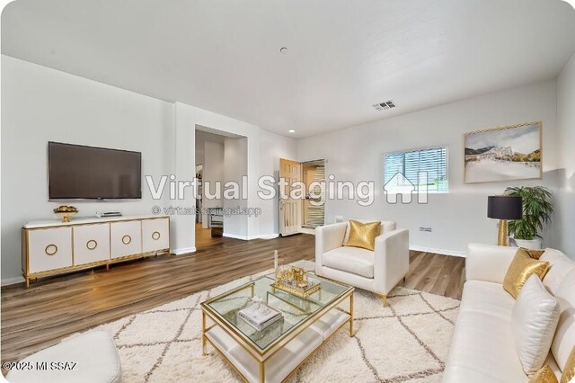 tiled living room featuring ceiling fan