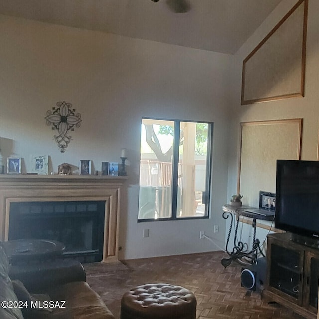 living area with a fireplace with flush hearth