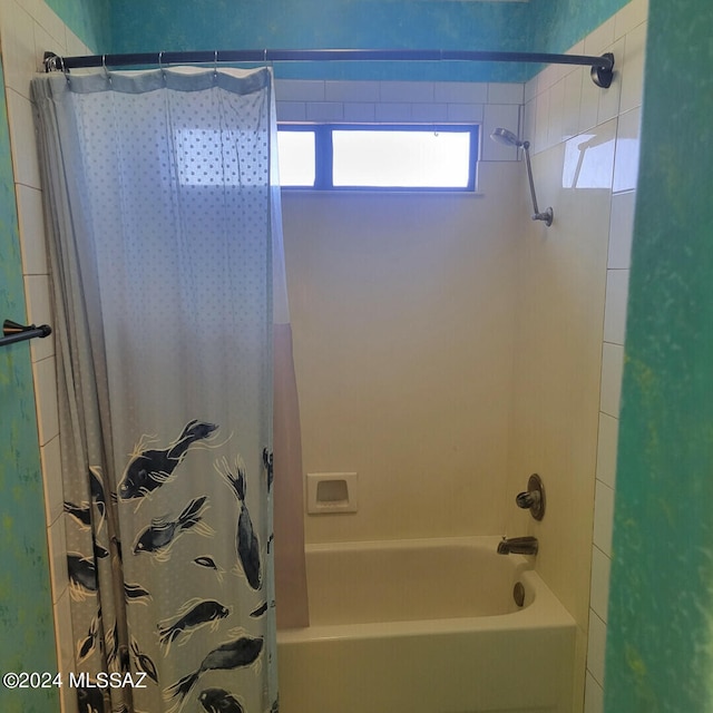 full bathroom featuring shower / bath combo with shower curtain