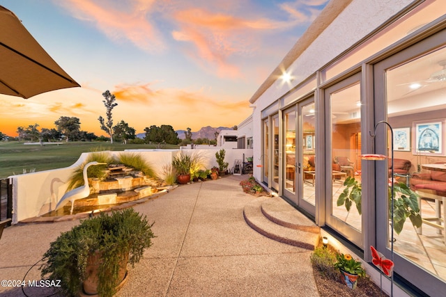 view of patio terrace at dusk