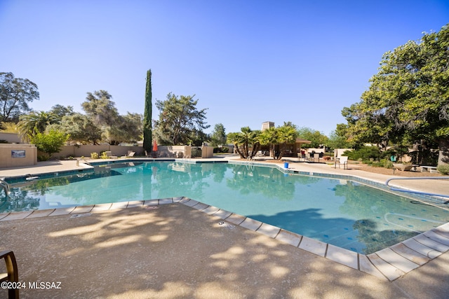 view of swimming pool featuring a patio area