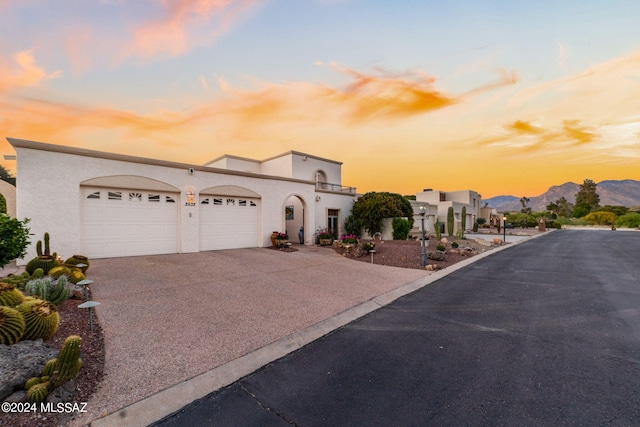 view of front of home featuring a mountain view and a garage