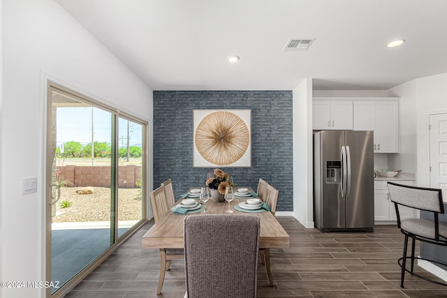 dining space featuring dark hardwood / wood-style flooring