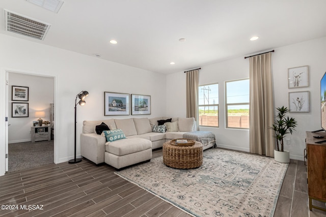 living room with dark hardwood / wood-style flooring