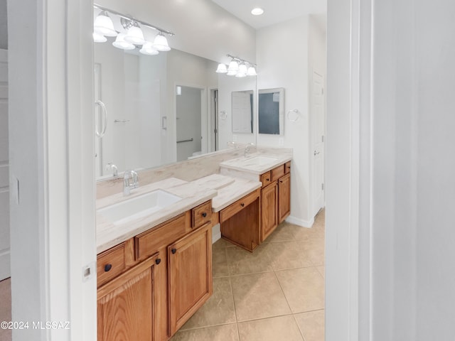 bathroom featuring dual bowl vanity and tile floors