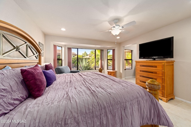 tiled bedroom with ceiling fan