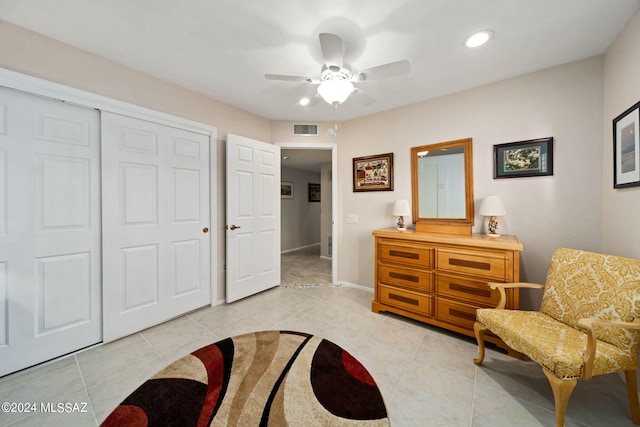 sitting room featuring light tile patterned floors and ceiling fan