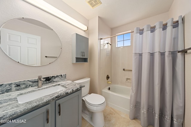 full bathroom with tile patterned floors, vanity, a textured ceiling, shower / bathtub combination with curtain, and toilet