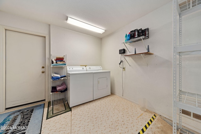 laundry room featuring washing machine and dryer