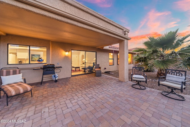 view of patio terrace at dusk