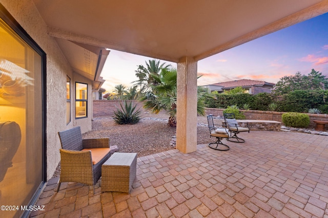 view of patio terrace at dusk