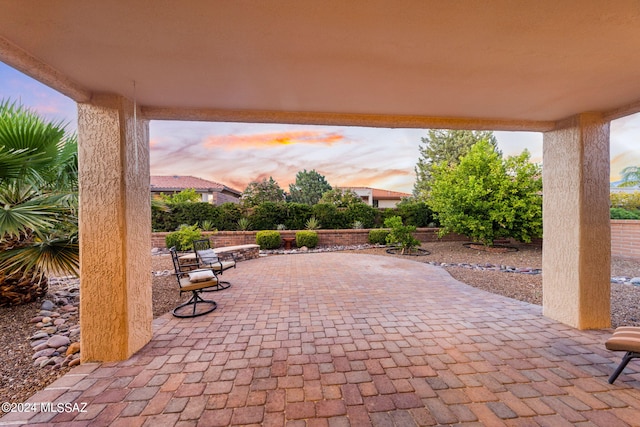 view of patio terrace at dusk