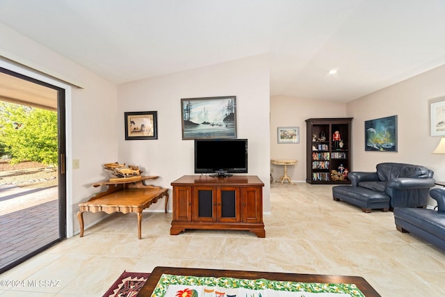 living room featuring lofted ceiling