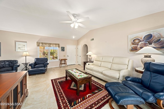 living room featuring ceiling fan, lofted ceiling, and light tile patterned floors