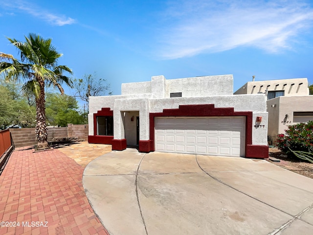 southwest-style home with a garage