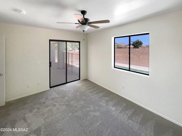 carpeted empty room with ceiling fan