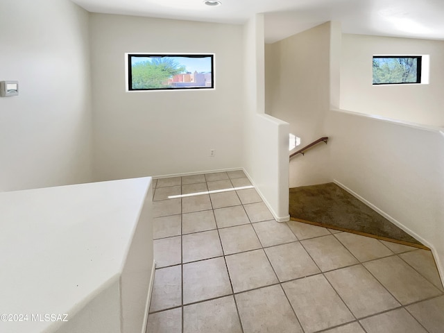 bathroom featuring tile patterned flooring and plenty of natural light