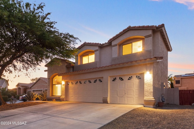 mediterranean / spanish-style house featuring a garage