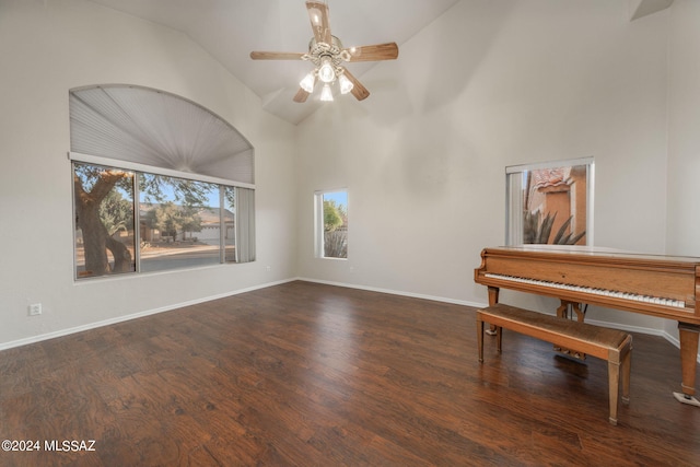 interior space with high vaulted ceiling, dark hardwood / wood-style flooring, and ceiling fan