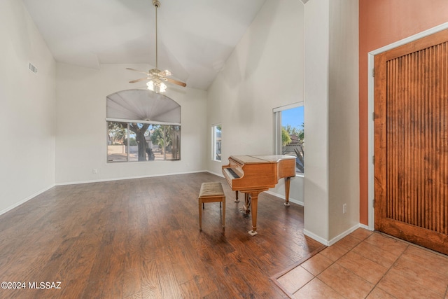 tiled home office featuring high vaulted ceiling, ceiling fan, and a wealth of natural light