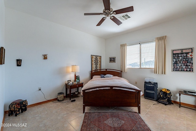 tiled bedroom with ceiling fan