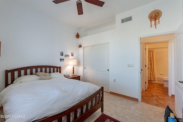 bedroom with ensuite bathroom, a closet, ceiling fan, and light tile floors