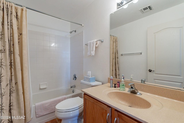 full bathroom featuring shower / bath combination with curtain, vanity, and toilet