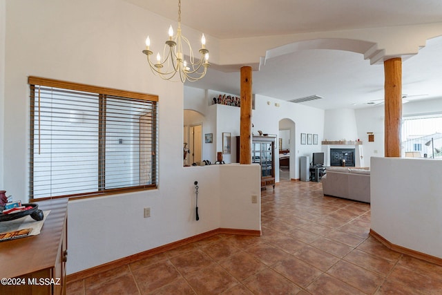 kitchen featuring tile flooring, an inviting chandelier, and pendant lighting