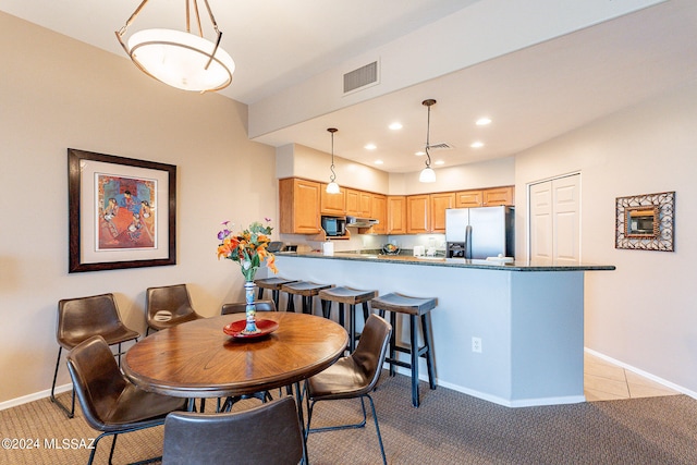 dining area with light carpet