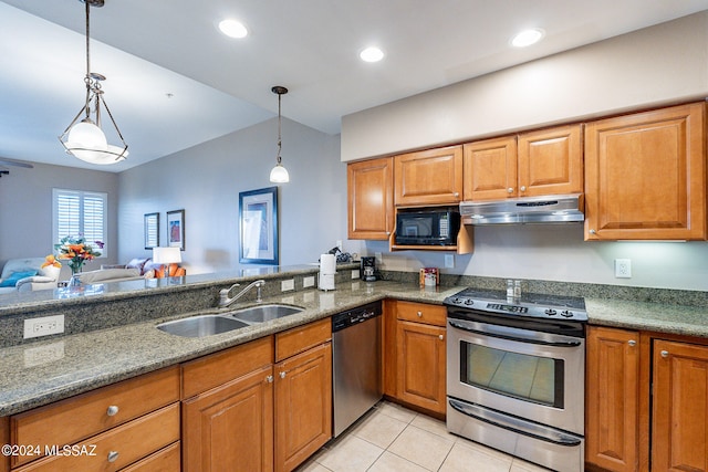 kitchen featuring decorative light fixtures, sink, appliances with stainless steel finishes, and light tile floors