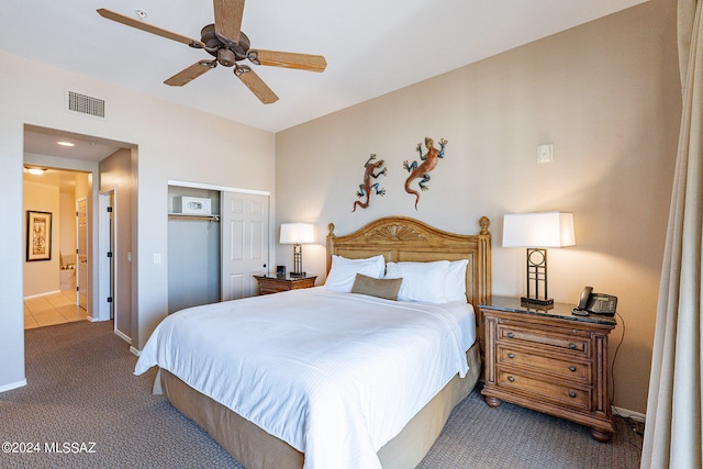 carpeted bedroom with a closet, ceiling fan, and connected bathroom