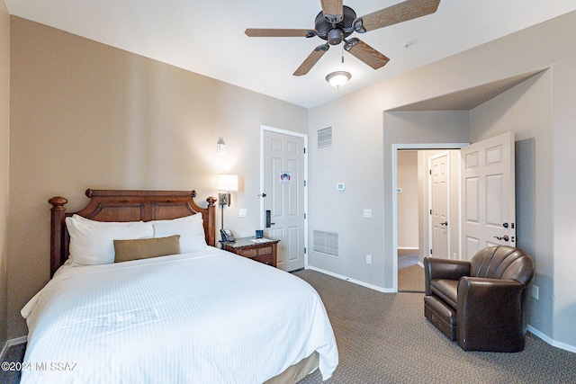 bedroom with dark colored carpet and ceiling fan