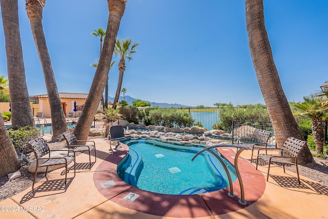 view of swimming pool with a patio