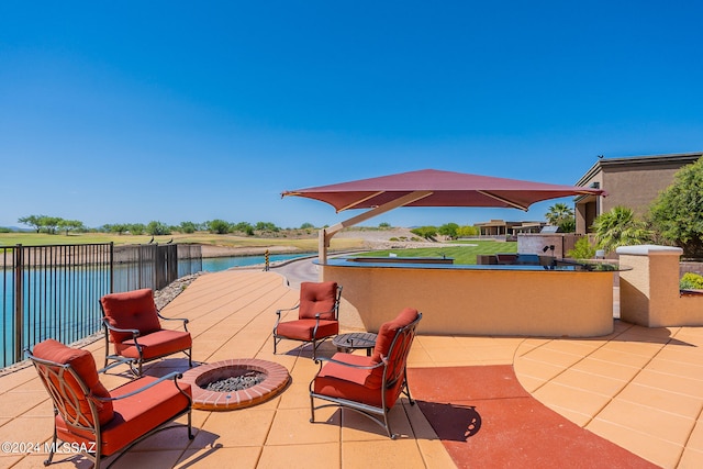 view of patio with an outdoor fire pit