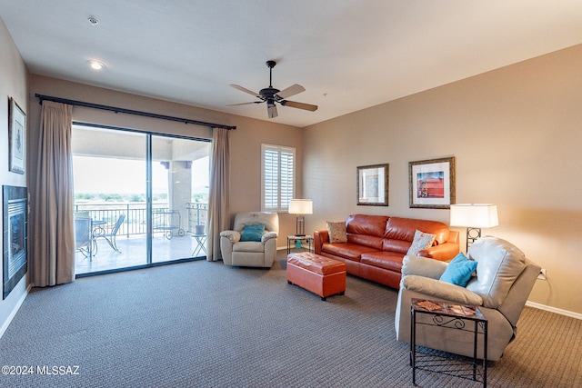 living room featuring ceiling fan and carpet flooring