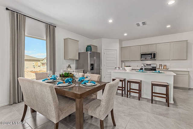 dining space with light tile floors