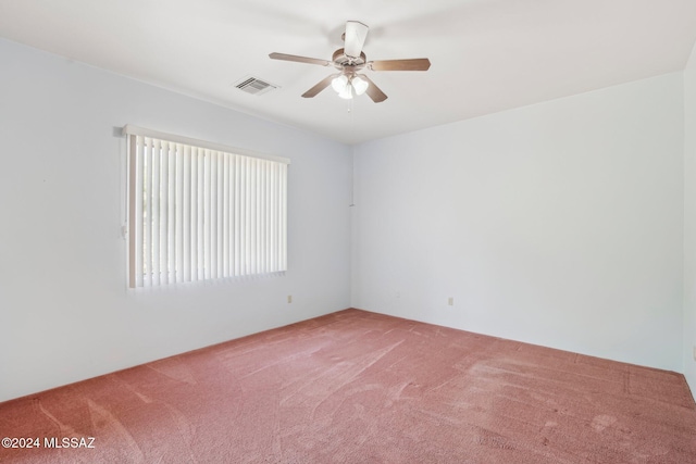 empty room with carpet flooring and ceiling fan