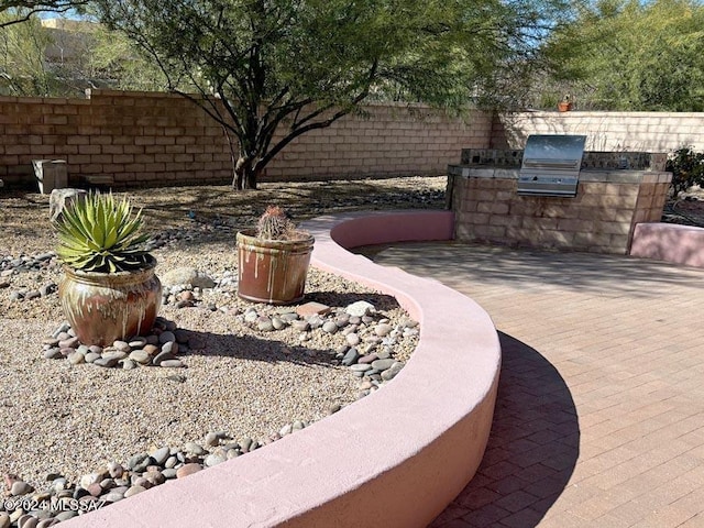 exterior space with area for grilling and a patio area