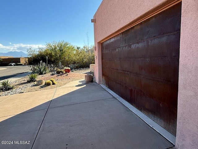 view of side of home with a mountain view