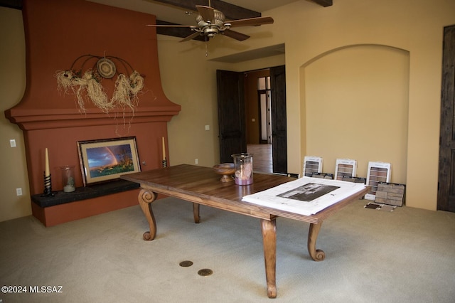 interior space featuring carpet and ceiling fan