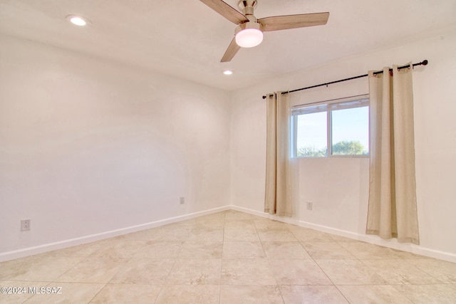 spare room featuring ceiling fan