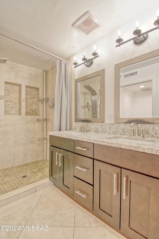 bathroom featuring a shower with shower curtain, vanity, tile patterned floors, and an inviting chandelier