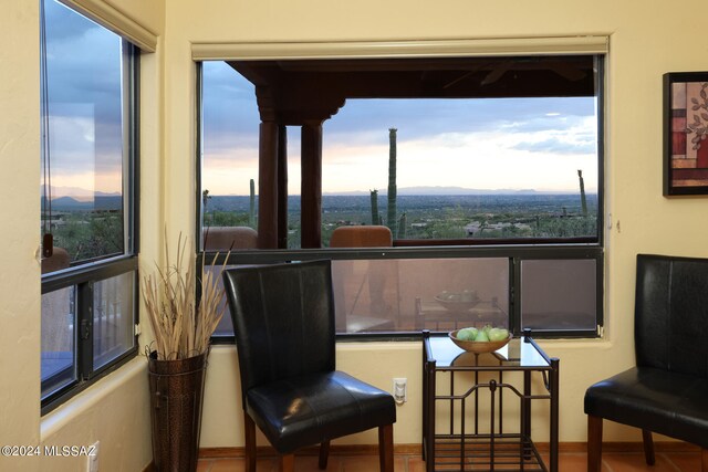 tiled living room with beam ceiling, a towering ceiling, and ceiling fan