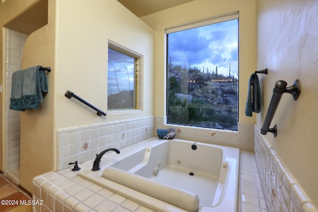 bathroom featuring tiled tub