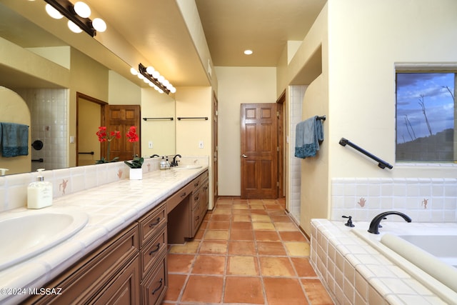 bathroom featuring vanity and independent shower and bath