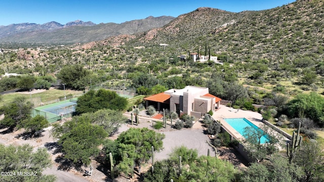 birds eye view of property featuring a mountain view