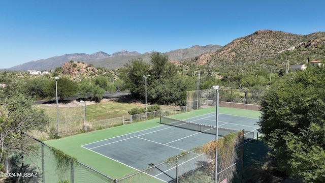 view of sport court with a mountain view