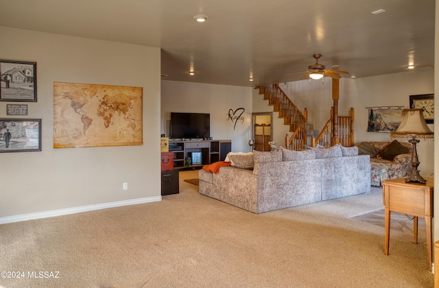 living room featuring ceiling fan and carpet floors