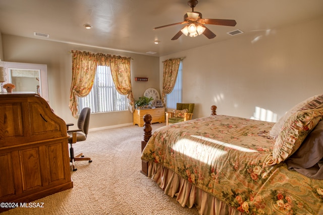 bedroom featuring light carpet and ceiling fan